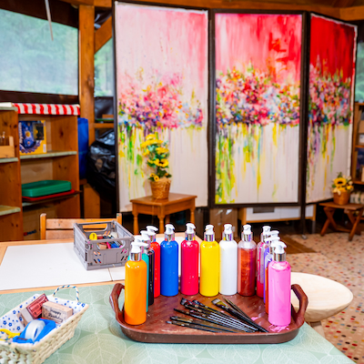 Children painting activity in forest playhouse Baisoara