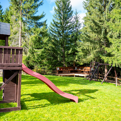 Outdoor playground with slide and swings Baisoara