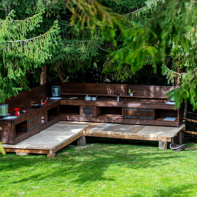 Wooden outdoor play kitchen at Simplicity Retreat